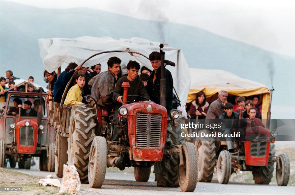 Refugees From Decane In Western Kosovo Yugoslavia Drive Their Tractors After Crossing Into Albani