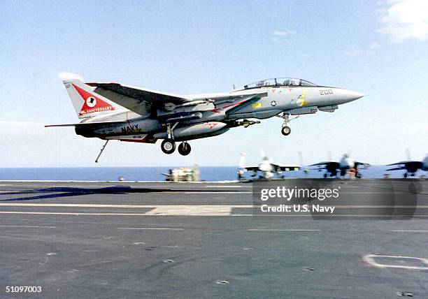 An F-14 "Tomcat" Assigned To The "Top Hatters" Prepares To Make An Arrested Landing On The Flight Following An Air Strike Mission Over The Former...