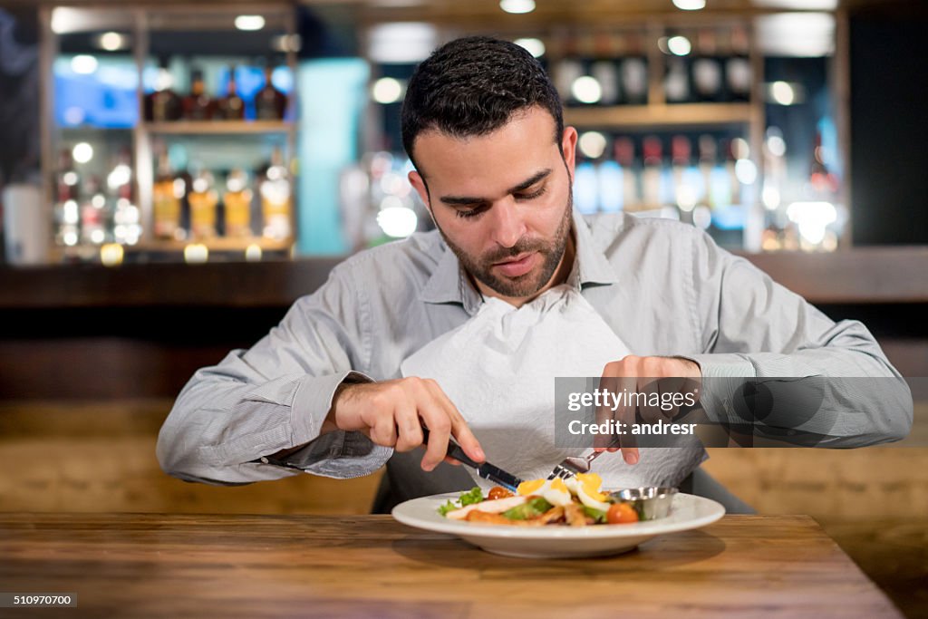 Man on a diet eating at a restaurant