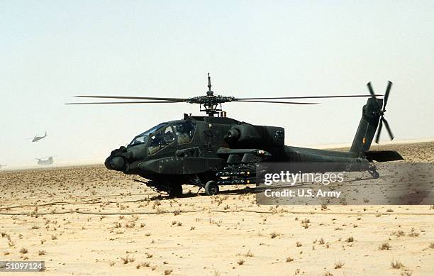 An Ah-64A Apache Anti-Tank Helicopter Of The Armed With Agm-114A Hellfire Anti-Tank Missiles, Is Prepared For A Mission During Operation Desert Storm...