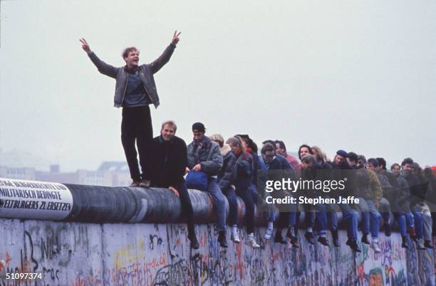 West Germans Celebrate The Unification Of Berlin Atop The Berlin Wall During The Collapse Of Communism In East Berlin On November 12, 1989. November,...