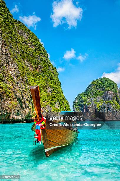 longtail wooden boat at maya bay, thailand - thailand stock pictures, royalty-free photos & images