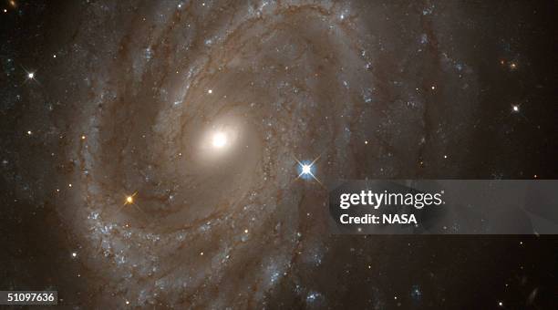 Nasa Hubble Space Telescope Shows The Spiral Galaxy Ngc 4603, The Most Distant Galaxy In Which A Special Class Of Pulsating Stars Called Cepheid...