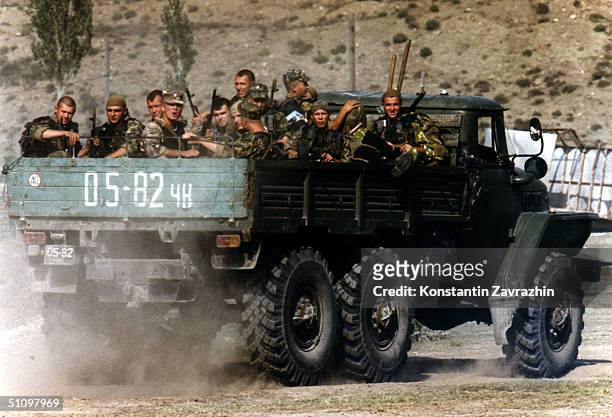 Russian Interior Ministry Soldiers Approach To Botlikh, Dagestan, Southern Russia, On A Truck, Sunday, August 8, 1999. Three Villages In Dagestan...
