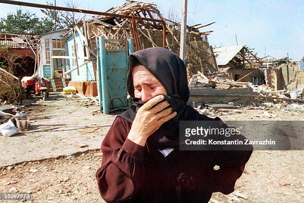 Year-Old Refugee Aishat Gandziyeva Cries After Returning To Her Home In The Village Verkhny Gamiyakh Near Khasavyurt, Dagestan September 11, 1999....