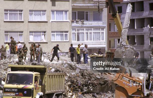 Rescue Teams Work To Find Survivors Under The Rubble Of Concrete Buildings Which Collapsed In The City Of Istanbul During The Earthquake That Shook...