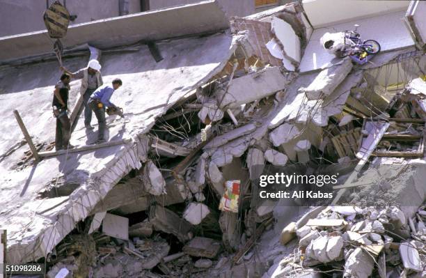 Rescue Teams Work To Find Survivors Under The Rubble Of Concrete Buildings Which Collapsed In The City Of Istanbul During The Earthquake That Shook...