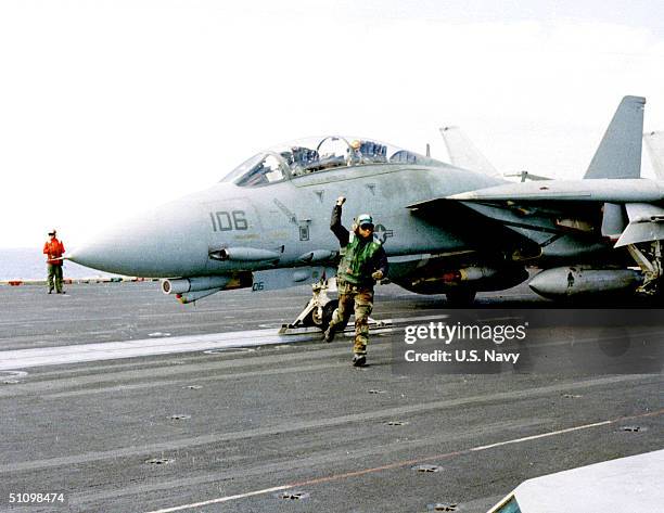 Flight Deck Crew Member Gives "The Thumbs Up" Signal, Indicating A Ready Launch For An F-14 "Tomcat" Fighter May 5, 1999. Roosevelt Is Currently On A...