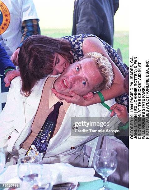 October 29, 1994 Paciofic Palasides, Ca, John Lydon And A Fan At The Cricket Aid'94 At Will Rogers State Park.