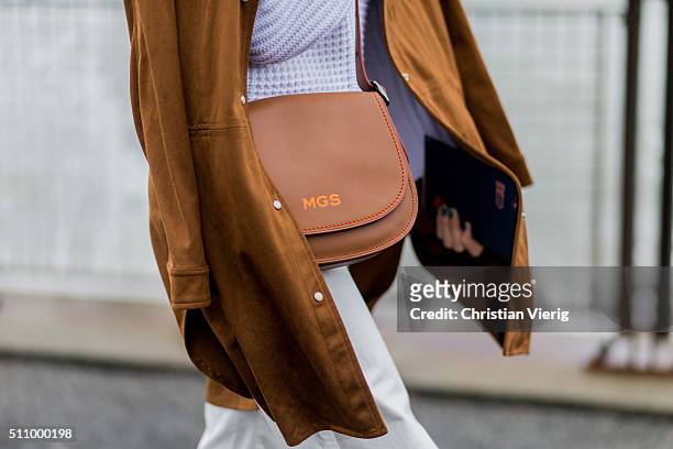Martha Graeff wearing a white sweater and a brown coat with fringes seen outside Coach during New York Fashion Week: Women's Fall/Winter 2016 on...