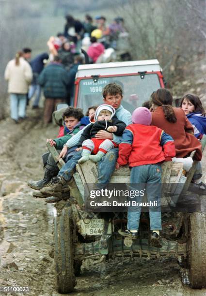 Ethnic Albanian Refugees From Marina Ride Tractors Down A Rugged Mountain Track As They Escape Fighitng Between The Yugoslav Army And The Kosovo...