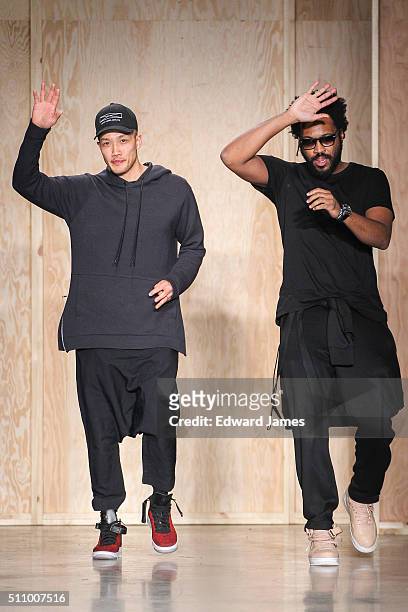 Designers Dao-Yi Chow and Maxwell Osborne walk the runway during the DKNY fashion show at Skylight Modern on February 17, 2016 in New York City.