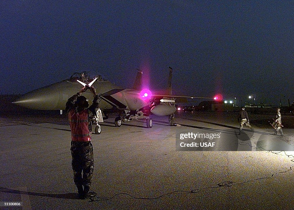 U S Air Force Ground Crewman Holds An F 15E
