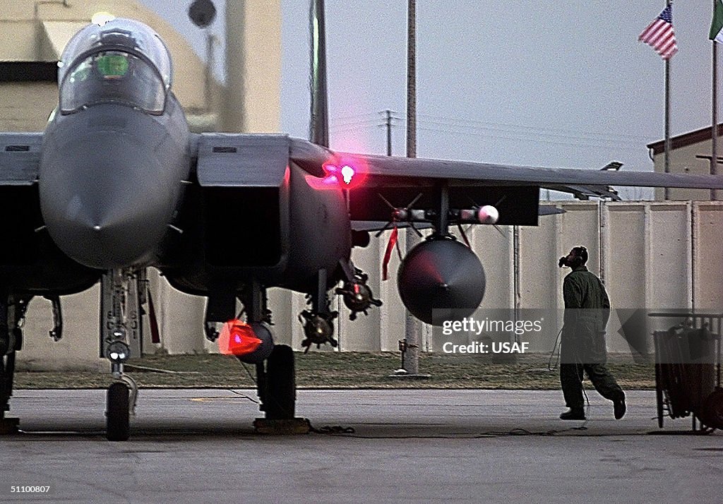 U S Air Force F 15E Strike Eagle Crew Chief Makes A Last Minute Check Of His Aircraft