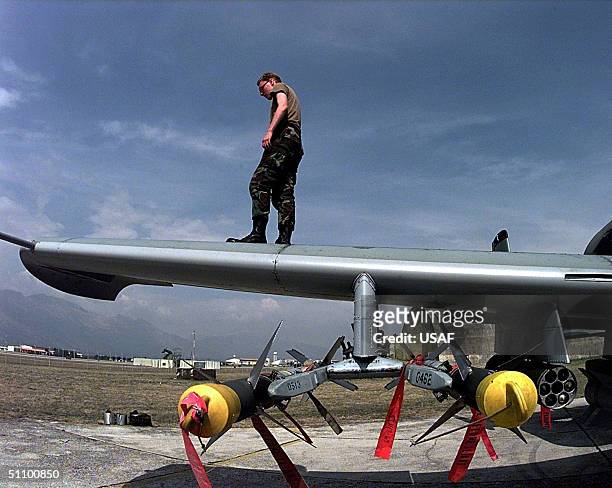 An Air Force Crew Chief Walks The Wing As He Does A Post-Flight Check Of An A-10 Thunderbolt Ii At Aviano Air Base, Italy, After It Was Flown Against...
