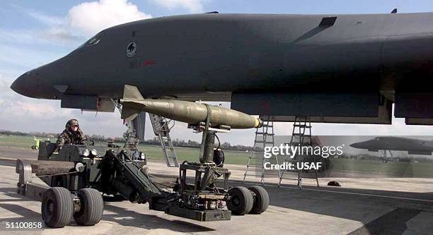 B1 Loading A Weapons Loader Transports A Bomb For Loading On A B1 Bomber April ...