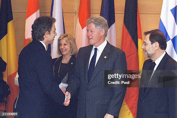 President Bill Clinton Welcomes British Prime Minister Tony Blair As Nato Secretary General Javier Solana Looks On At The Opening Of The Nato Summit...