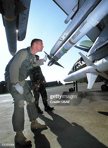 An F-16 Pilot With The 77Th Fighter Squadron Does A Preflight Munitions Inspection Before Flying A Mission In Operation Northern Watch Over Iraq.