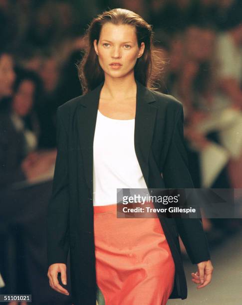 Model Kate Moss Walks The Runway At The Calvin Klein Spring Fashion Show In New York, September 18, 1998.