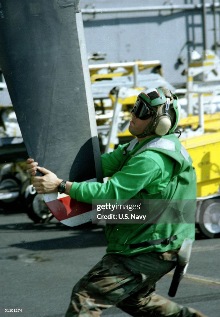 Flight Deck Personnel Inspect A Propeller On An E 2C Hawkeye Surveillance And Command And Control