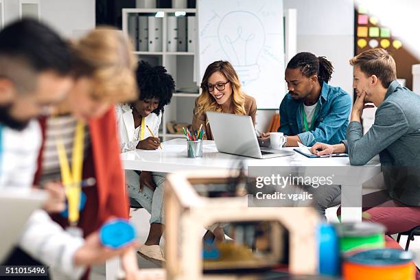 group of entrepreneurs at work in office - public housing stock pictures, royalty-free photos & images