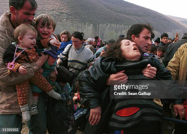 Woman Overcome By Heat Gets Assistance At Blace, Macedonia, April 6 At The Border With Kosovo, Where An Estimated 40,000 Kosovo Alabanian Refugees...