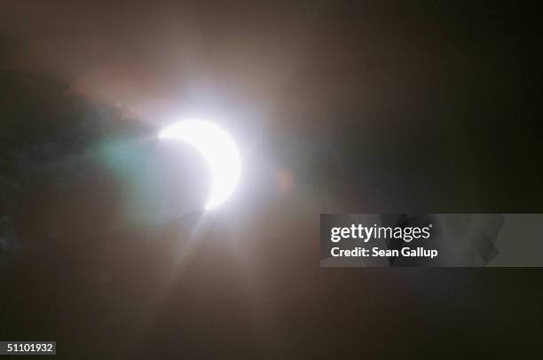 The Sun Reemerges From Behind The Moon Through A Cloud Over Southern Bavaria, Germany, Just After A Total Solar Eclipse August 11, 1999. Millions Of...