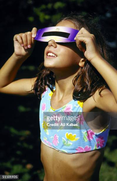 Girl Views The Solar Eclipse With A Special Viewer In Istanbul, Turkey, August 11, 1999.