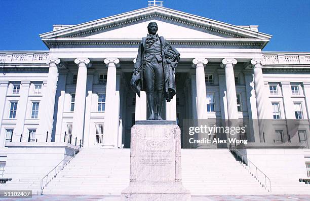 The Sculpture Of Alexander Hamilton, The First Secertary Of The Treasury, Stands In Front Of The Treasury Department Building In Washington Dc,...