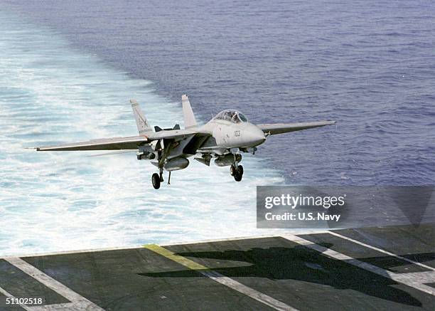 An F-14 "Tomcat" From The "Swordsmen" Of Fighter Squadron Three Two Makes Its Final Approach Prior To Reaching The Carrier On March 6, 1999. USS...