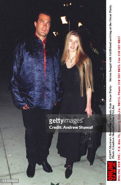 Beverly Hills, Ca. Steven Seagal With Arissa Wolf Arriving Morton's Resturant For The Vanity Fair Post-Oscars Party.
