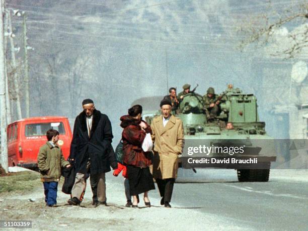 An Ethnic Albanian Refugee Family From Gajre, A Village Which Was Shelled By Serb Forces Last Weekend, Trudge Towards The Border With Macedonia In...
