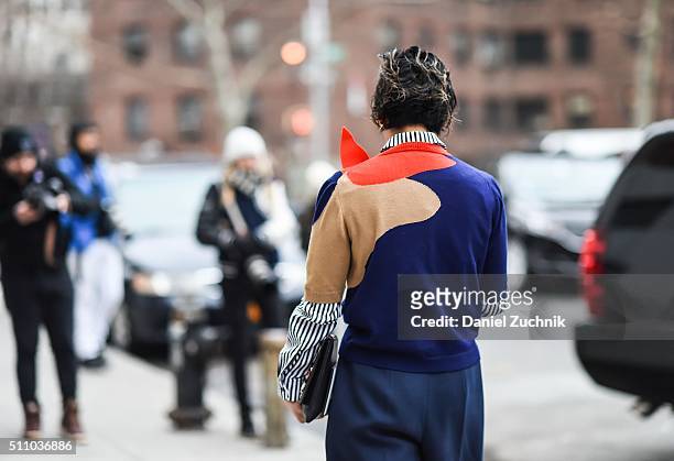 Jeannie Lee is seen outside the DKNY show wearing a striped shirt, 3d graphic sweater and blue pants during New York Fashion Week: Women's...
