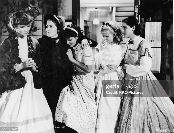 American actresses Katharine Hepburn , Spring Byington , Jean Parker, Joan Bennett , and Frances Dee crying in character as the March women in a...