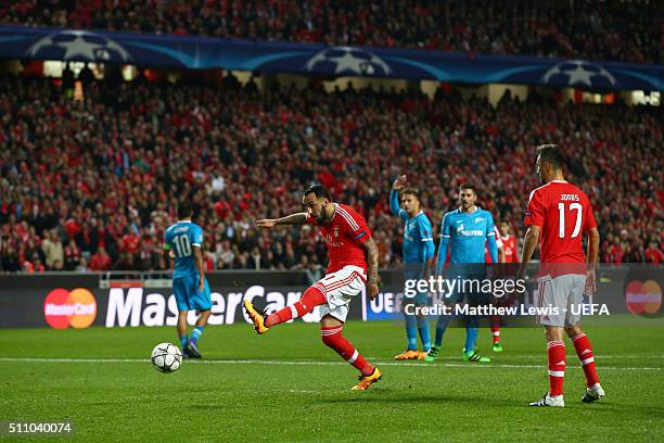 Kostas Mitroglou of Benfica shoots during the first leg of the UEFA Champions League Round of 16 match between SL Benfica and FC Zenit at Estadio da...