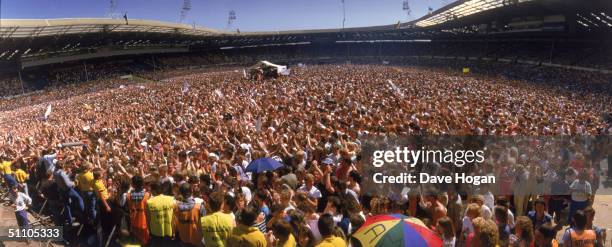 Panoramic view of the crowd at the Live Aid charity concert, Wembley Stadium, London, 13th July 1985.