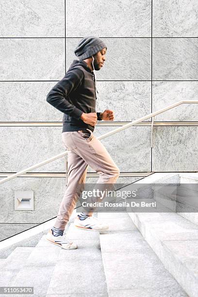 cheerful man running outdoors in the early morning - speed walking stock pictures, royalty-free photos & images