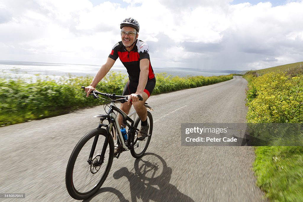 Cyclist on coastal road