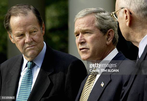 President George W. Bush makes a few remarks after meeting with the Thomas Kean and Lee Hamilton members of the Independent Commission investigating...