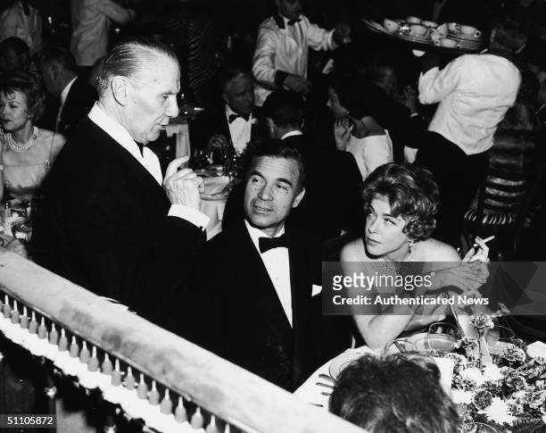 At the El Morocco restraurant, owner John Perona describes some of the menu items to Dominican diplomat and socialite Porfirio Rubirosa and Mrs....