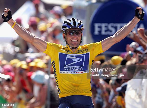 Lance Armstrong of the USA and riding for US Postal Service presented by Berry Floor celebrates as he wins stage 17 of the Tour de France on July 22,...