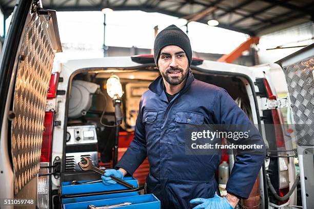 mechanic technician on a garage - plumber van stock pictures, royalty-free photos & images