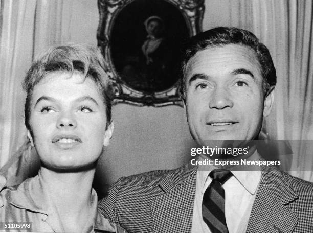 French actress Odile Rodin poses with Dominican diplomat and socialite Porfirio Rubirosa at a press conference where Rubirosa announce his intention...