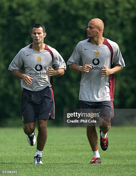 Ryan Giggs and Wes Brown jog during training with Manchester United at the NovaCare Complex on July 22, 2004 in Philadelphia, United States.