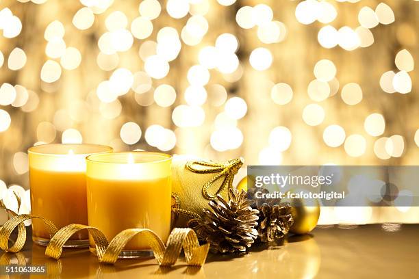 golden christmas - burning candle stock pictures, royalty-free photos & images