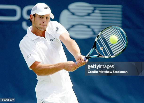 Andy Roddick returns a shot to Michel Kratochvil of Switzerland during the RCA Championships July 22, 2004 at the Indianapolis Tennis Center in...