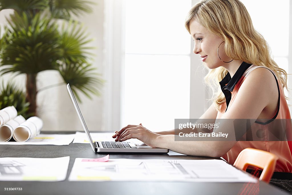 Business woman working on a laptop.