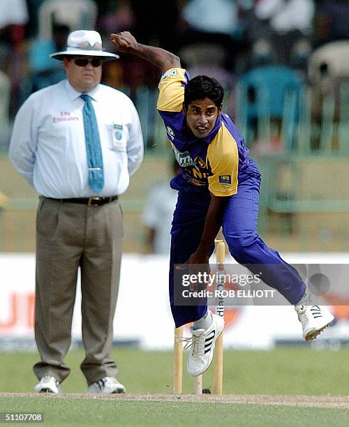 Sri Lankan bowler, Chaminda Vaas gets airborne as he delivers a ball in the Match between Sri Lanka and Bangladesh in Colombo, 23 July 2004, as part...