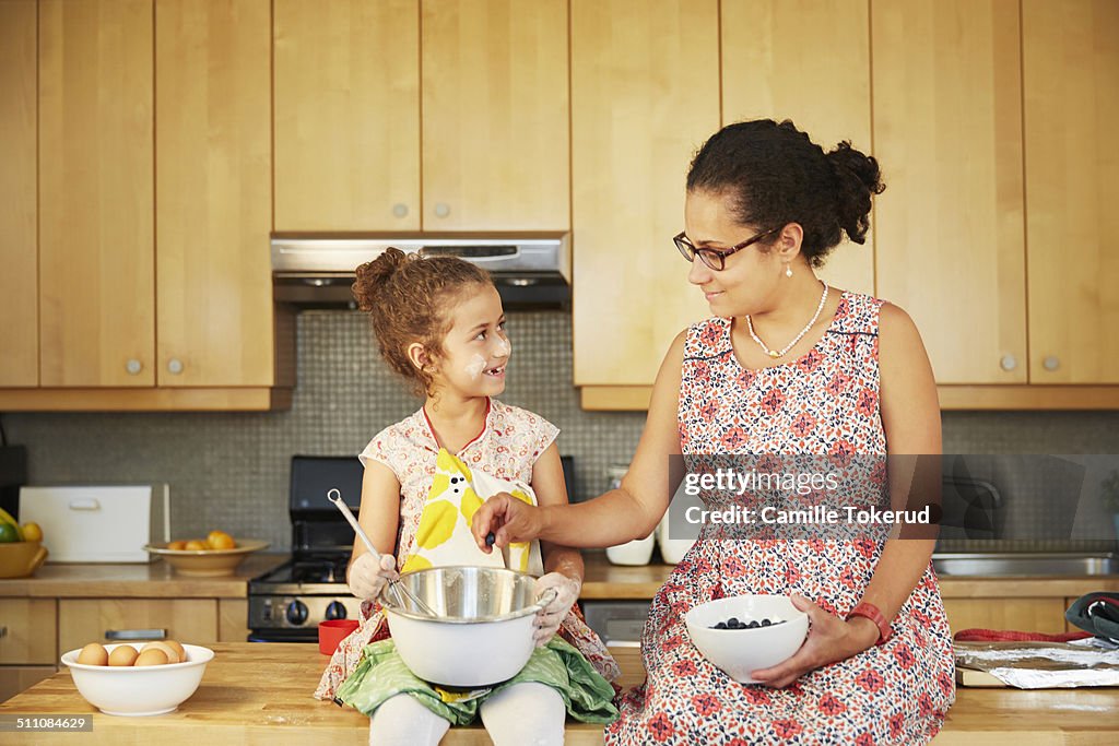 Mother and daughter at the kitchen