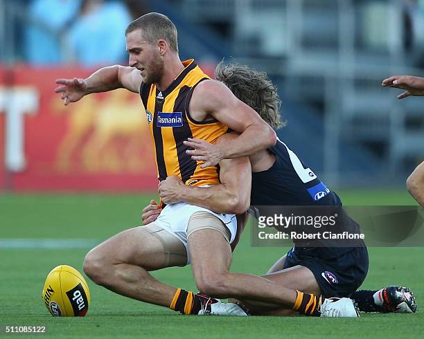 Jonathan O'Rourke of the Hawks is tackled during the 2016 AFL NAB Challenge match between the Hawthorn Hawks and the Carlton Blues at Aurora Stadium...